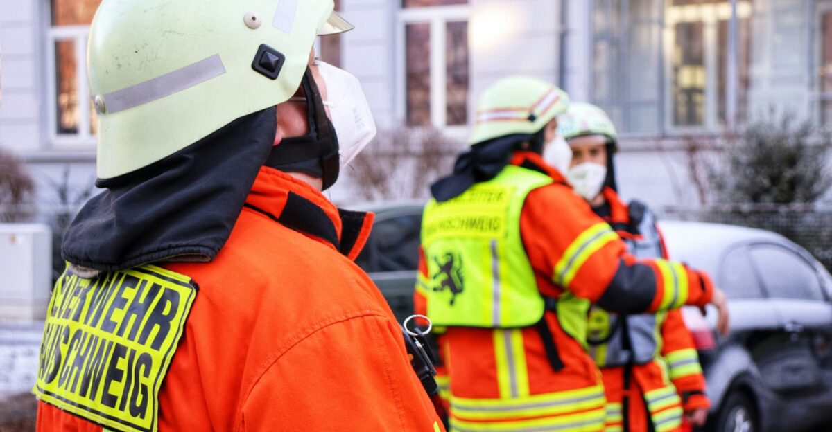 a group of firemen standing next to each other