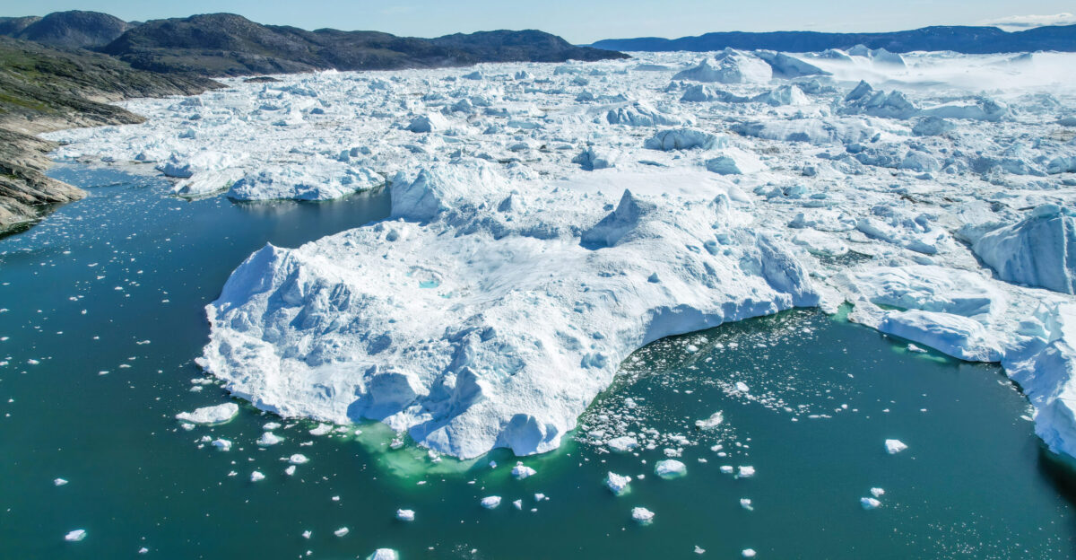 Aerial view of Jakobshavn Glacier at Disko Bay Greenland The calving of this great glacier dumps around 35 billion tonnes of icebergs into Disko Bay every year