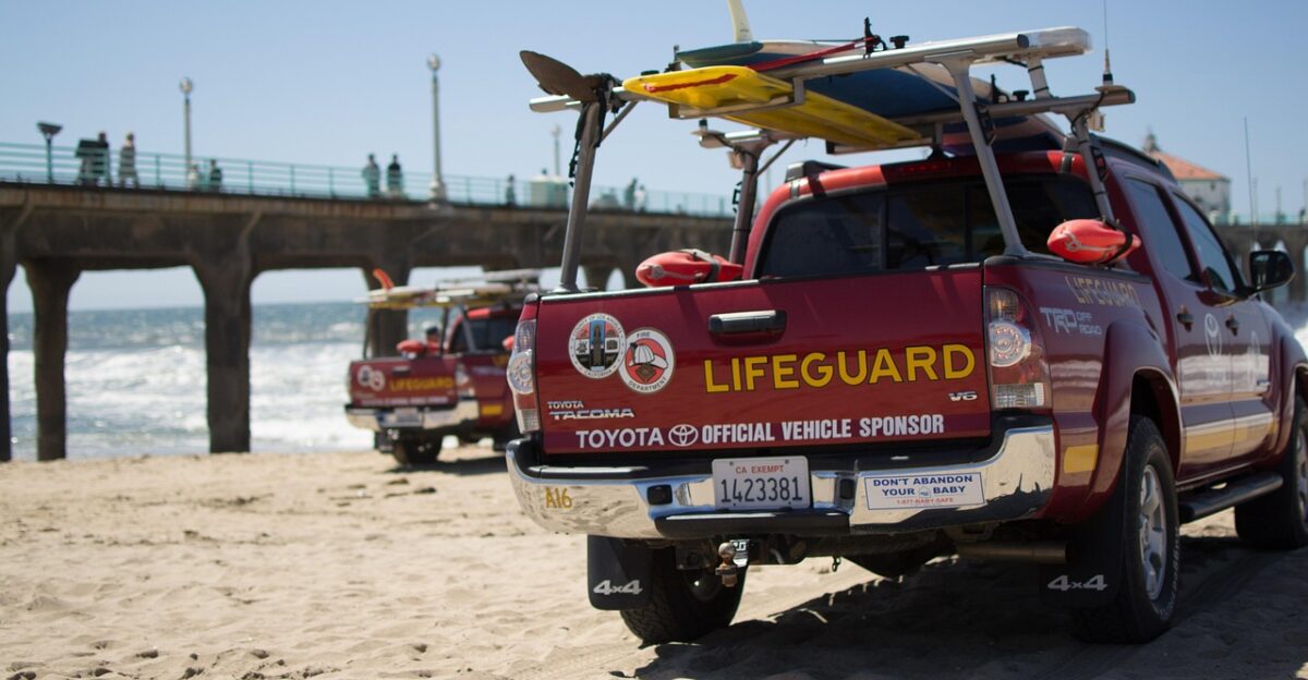 los angeles life-saving automobile beach manhattan beach red nature pier usa california sand vehicle surfboard summer sea toyota vacation lifeguard surfing