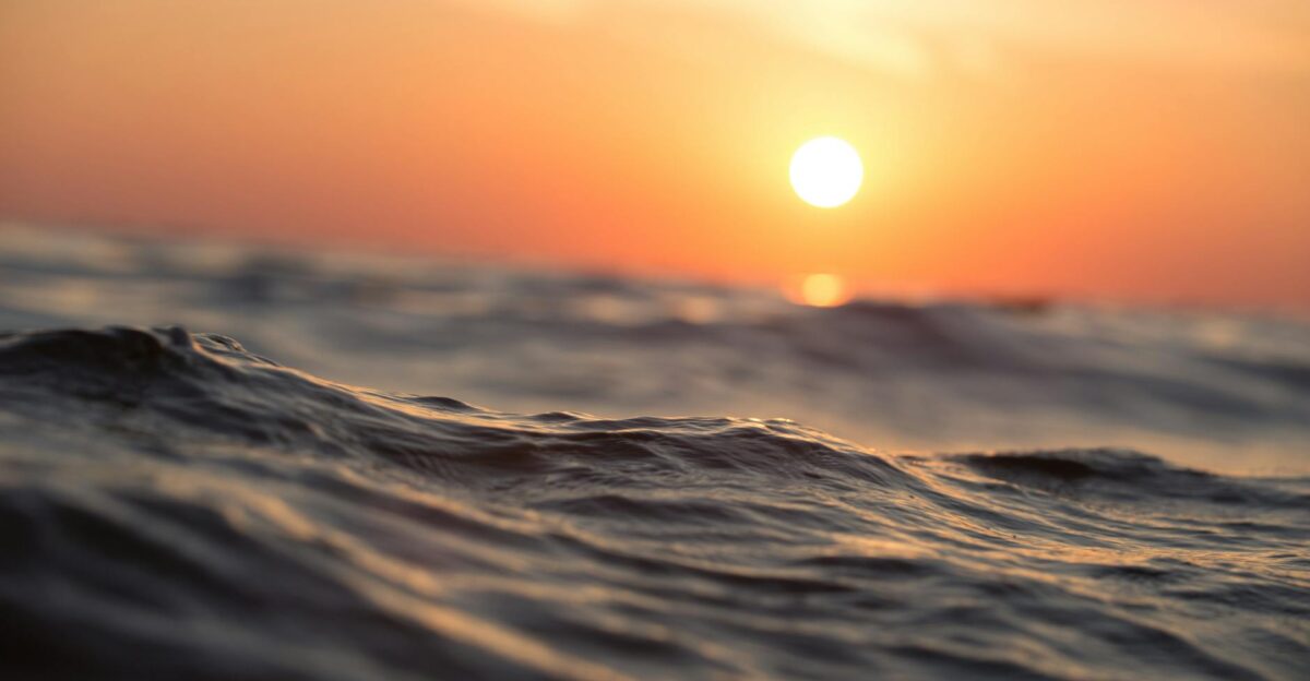 Captivating ocean waves with a vibrant sunset sky perfect for tranquil moments