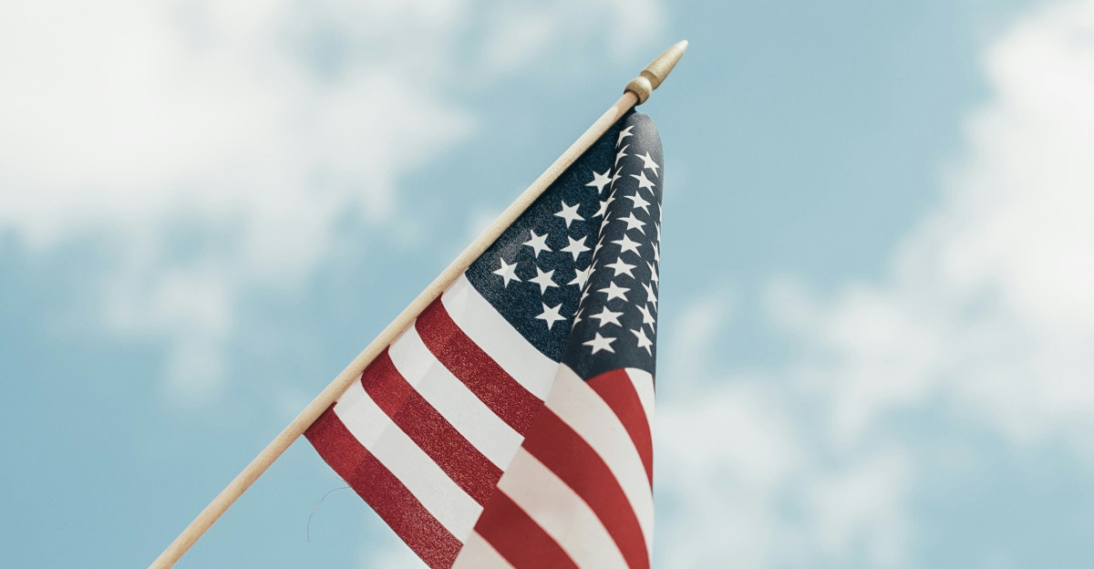 person holding U S A flag