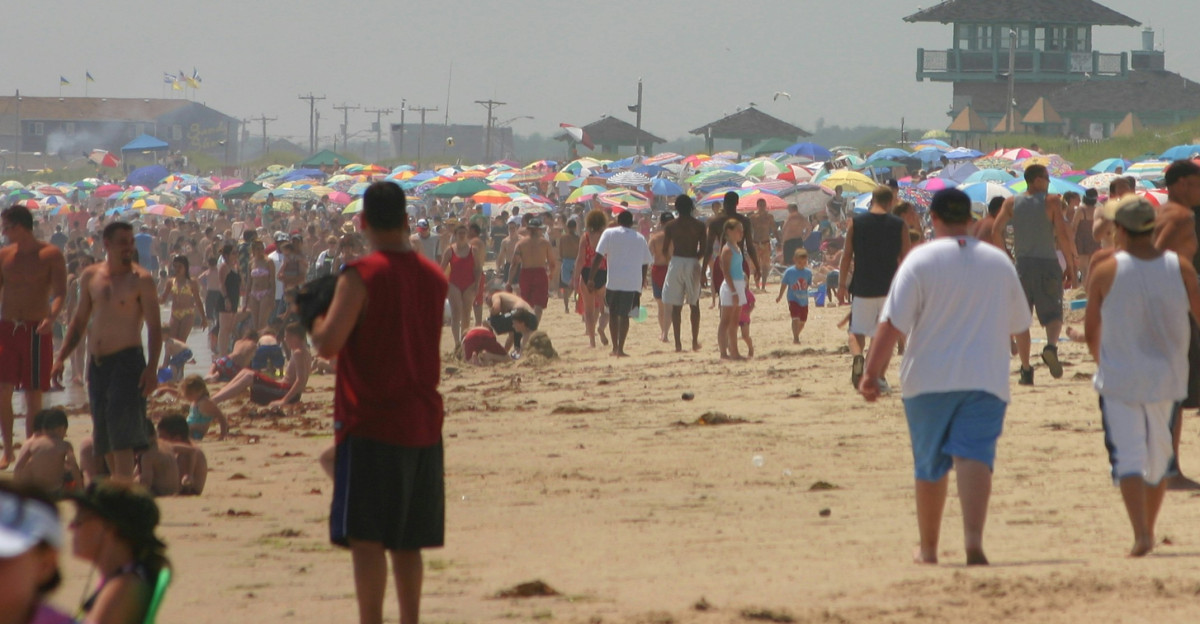 a large crowd of people at a beach