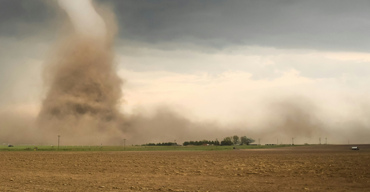 a large tornado is coming out of the sky