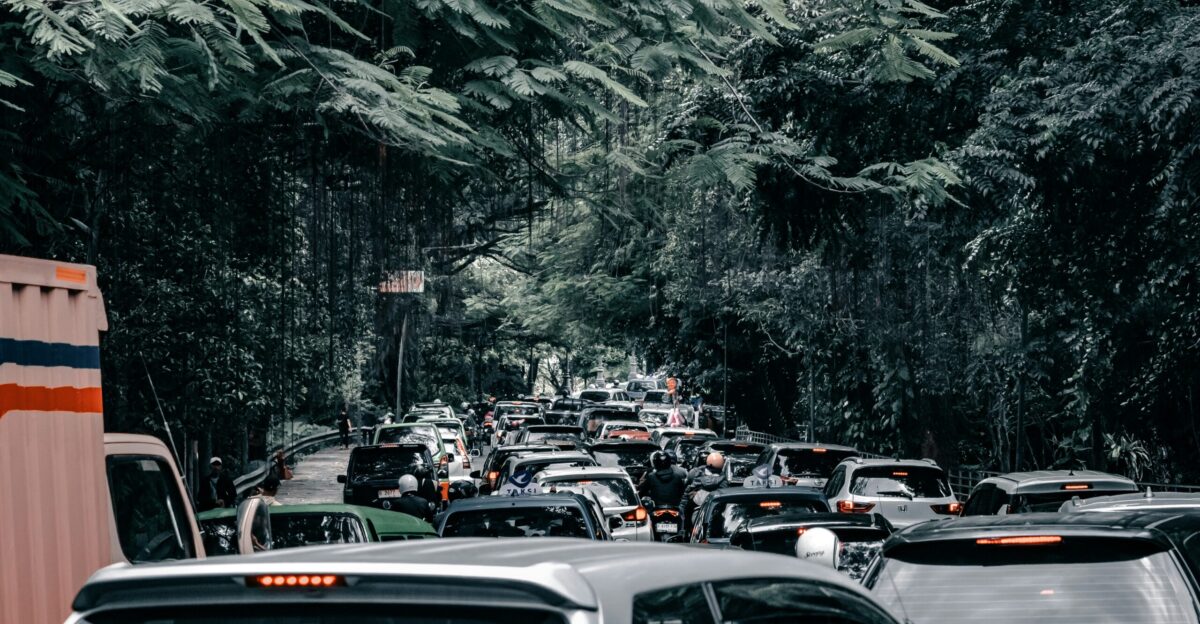 A bunch of cars that are sitting in the street